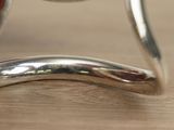 a close up view of a silver object on a table