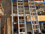 a ladder that is leaning against a wall in a garage