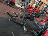 a gym with a lot of machines in it
