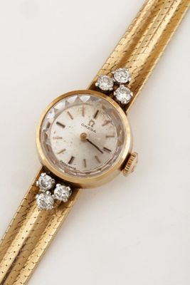 an image of a woman ' s wrist watch with diamonds on it