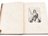 an open book with a drawing of a woman holding a staff