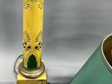 a green lamp that is next to a yellow lamp