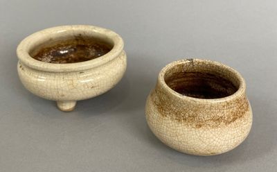 two small bowls sitting next to each other on a table