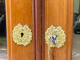 a door with a bell hanging from it ' s handle