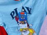 a blue t - shirt with a paw patrol design on it