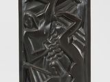 an image of a black candle holder with a metal design on it