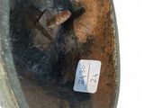 a close up of a piece of metal that has a screw in it