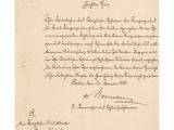 une lettre écrite à l'encre noire sur une feuille de papier