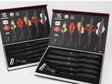pair of knives in a black box with red trimmings