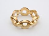 a close up of a gold chain bracelet on a white surface