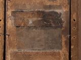 a picture of an old wooden door with a sticker on it