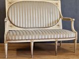 an image of a white couch sitting on top of a hard wood floor