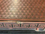 a wooden box with a design on it