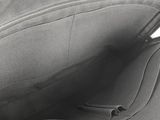 the inside of a black purse with a zipper on it