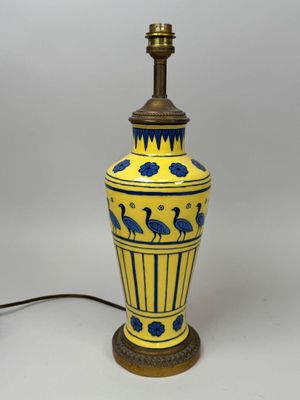 an image of a yellow and blue vase lamp with birds on it
