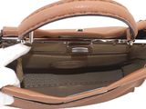 the inside of a brown purse with a white glove on it