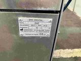 an image of a metal refrigerator with a sign on it