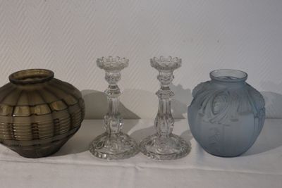 three glass vases sitting on a table next to each other