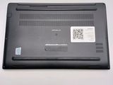 a close up of a laptop with a q - code sticker on it