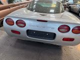 a silver sports car parked in a parking lot