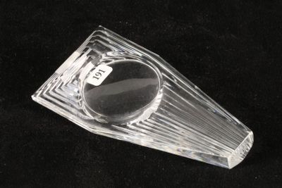 a clear glass object on a black surface