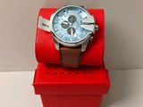 a watch that is sitting on top of a red box