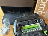 a robot that is sitting on a table next to a box
