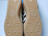 the soles of a pair of shoes on a white surface