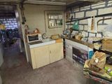 an image of a kitchen with a sink and a stove