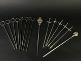 a set of six silver plated swords and a pair of scissors