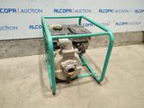 a close up of a small engine on a stand in front of a wall