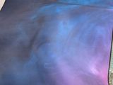a blanket that has a picture of a blue and pink sky on it