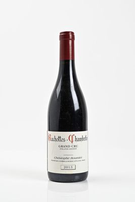 a bottle of wine that is sitting on a table