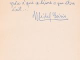 une vieille carte postale sur laquelle figure une citation écrite à la main