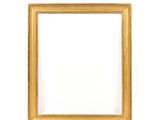 an empty wooden picture frame on a white wall