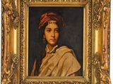 un tableau représentant une femme portant un turban, dans un cadre doré