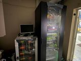 an image of a refrigerator and a computer in a room