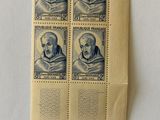 a close up of four stamps on a piece of paper