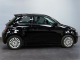 a picture of a small black car parked in a garage
