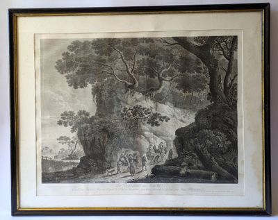 an old picture of a man and a horse in a wooded area