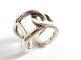 silver ring with a double loop design on a white background