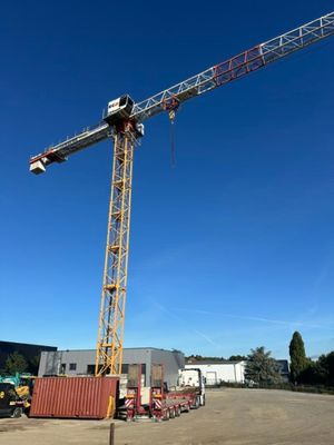 a crane that is standing in the middle of a parking lot