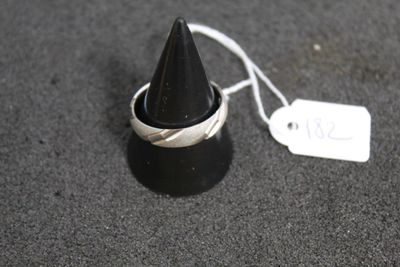 a black cone with a tag on it on the ground