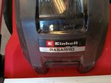 a close up of a red and black vacuum cleaner