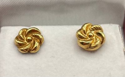 two pairs of gold tone earrings in a gift box