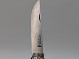 a knife that is sitting on top of a knife holder
