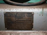 a metal sign on the side of a machine