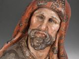 statue of a man with a beard and a turban on his head