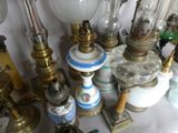 many different types of antique lamps on the table