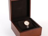 wooden box with watch inside on white background with white background